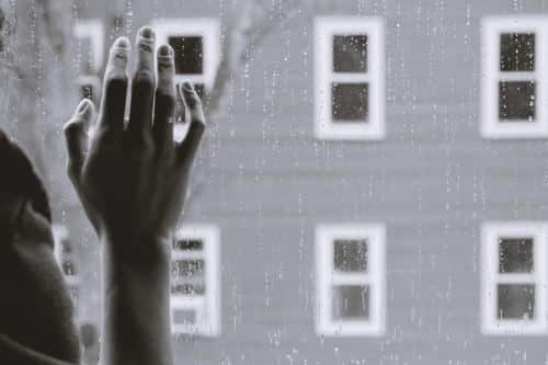 A woman's hand on a window